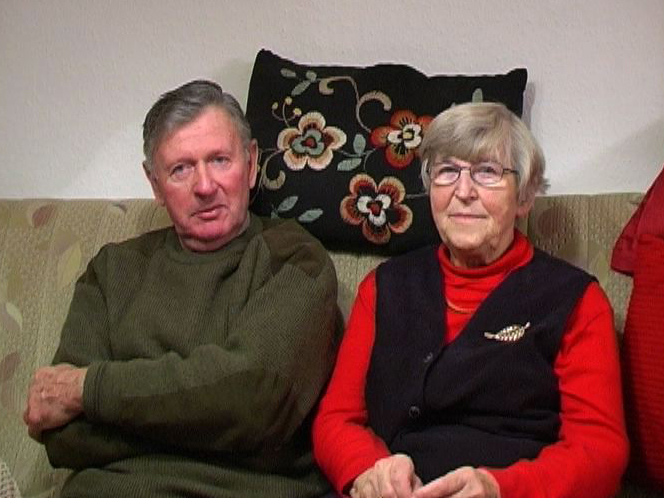 elderly couple on sofa
